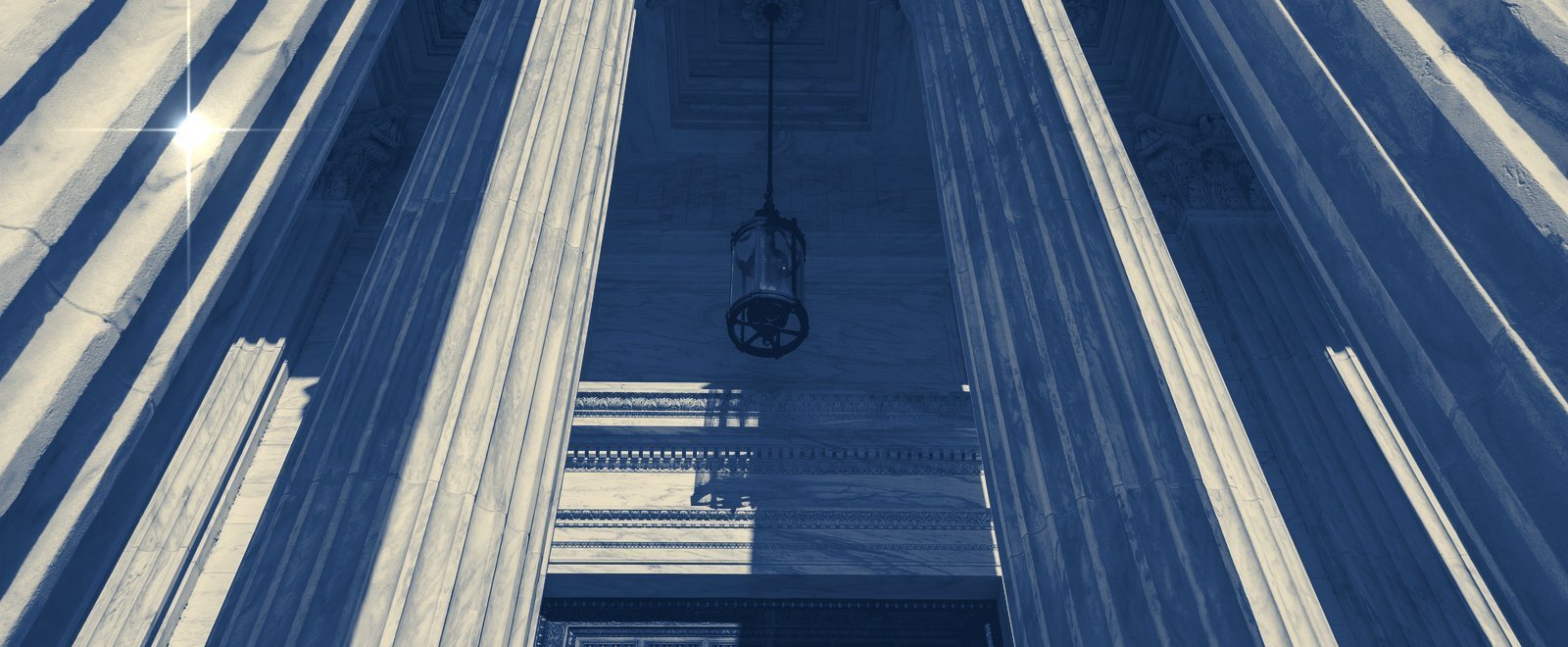 Classical courthouse columns, representing business and contract law